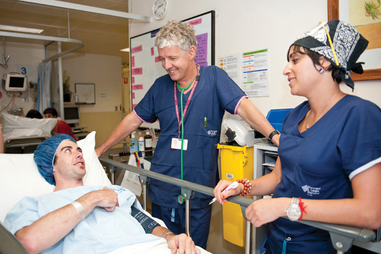 Professor Paul Myles with nurse Heidi Harrosh explains the pre-operative procedure to a patient